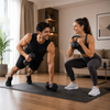 Man and woman exercising with dumbbells and kettlebells in a living room.